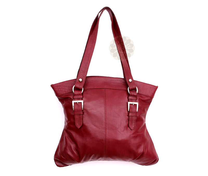 Vogue Crafts & Designs Pvt. Ltd. manufactures Ladies Maroon Handbag at wholesale price.